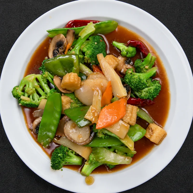 Spicy Hunan mixed vegetables with broccoli, mushrooms, baby corn and snow peas