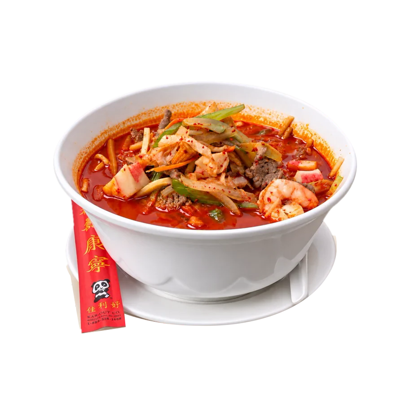 Spicy seafood noodle soup with shrimp and crab in a white bowl